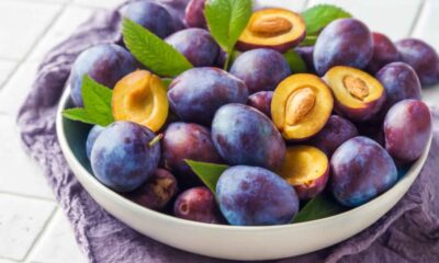 A bowl filled with fresh plums, showcasing the vibrant colors and highlighting the plum benefits for health